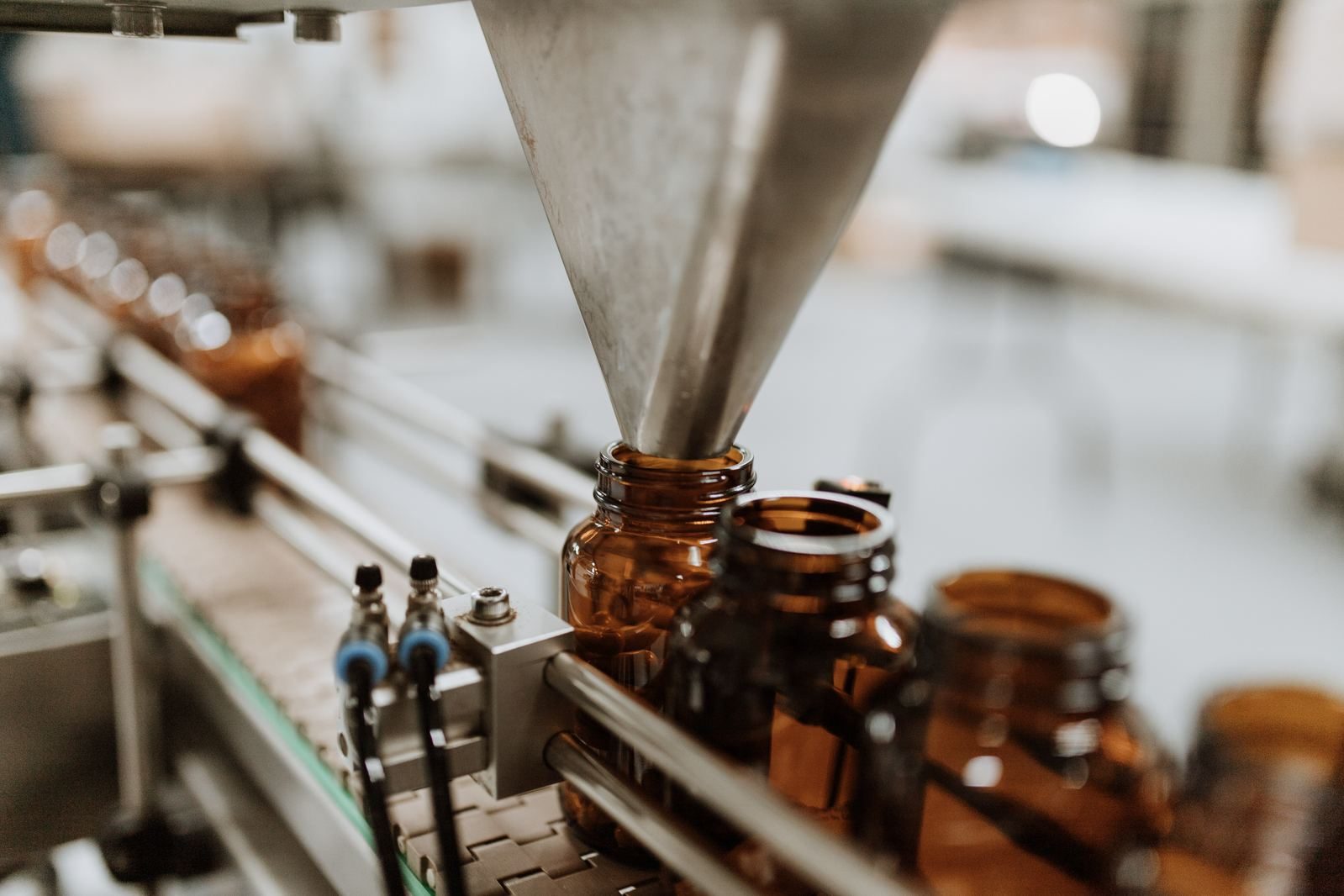 Amber bottles on the filling line