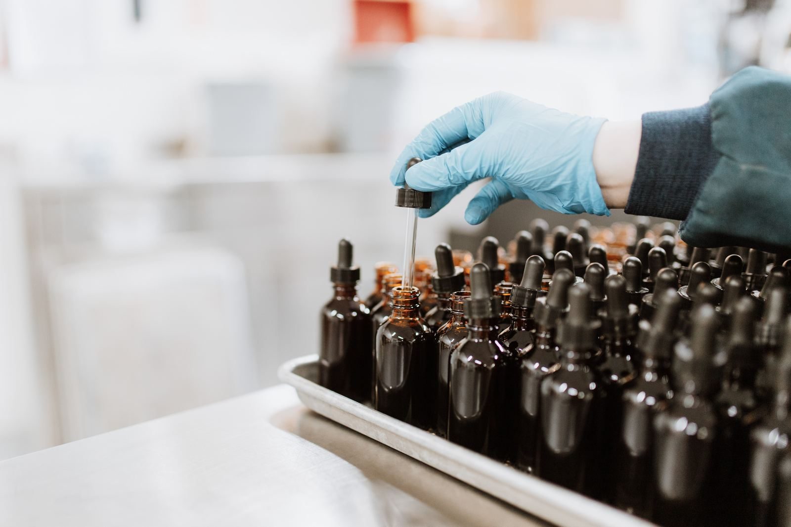 Dropper bottles being assembled